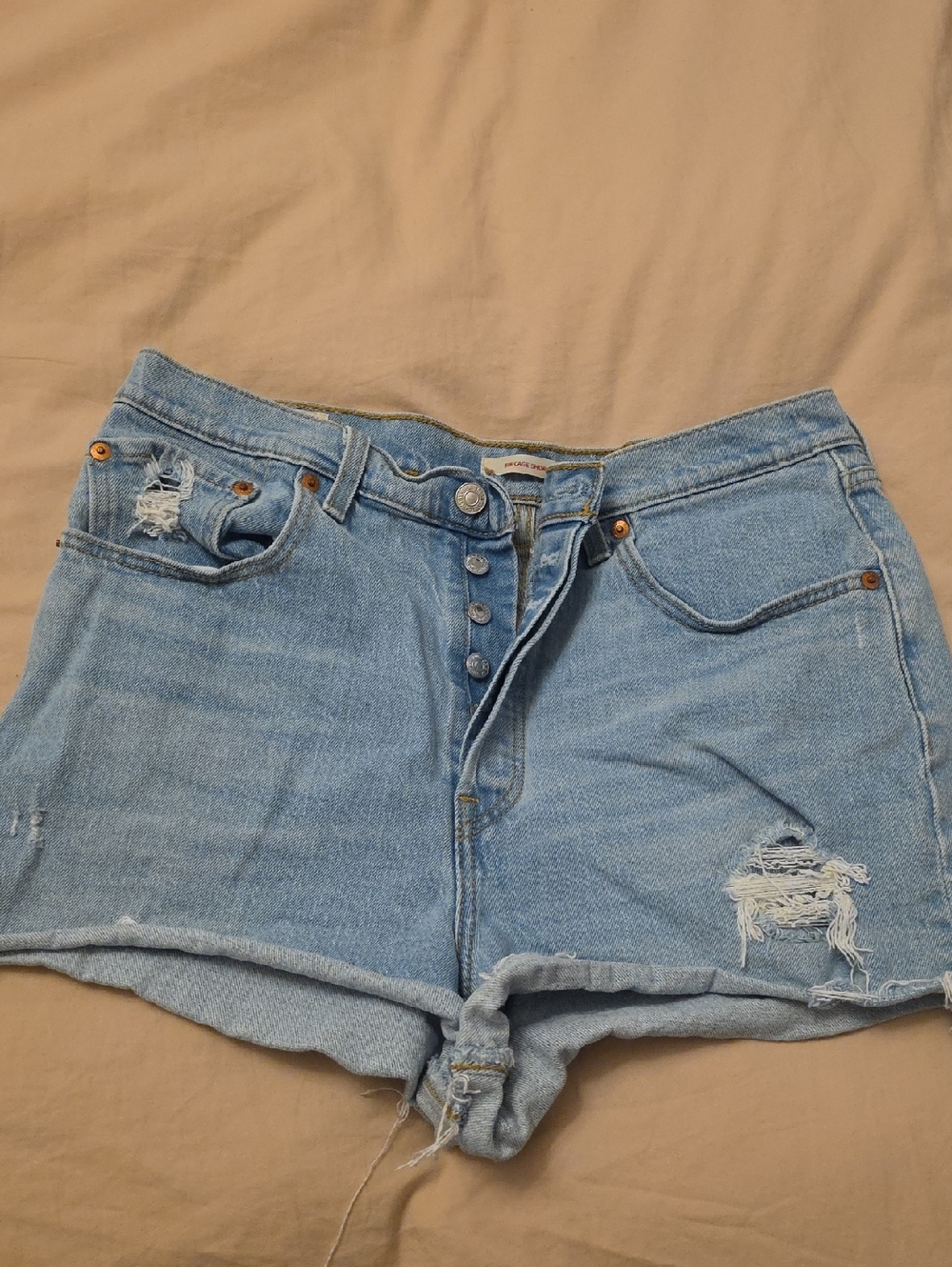 Levis High-Rise Multi Button Light Blue Distressed Denim Shorts